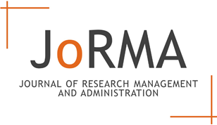 A white rectangular sign with black and orange text

Description automatically generated